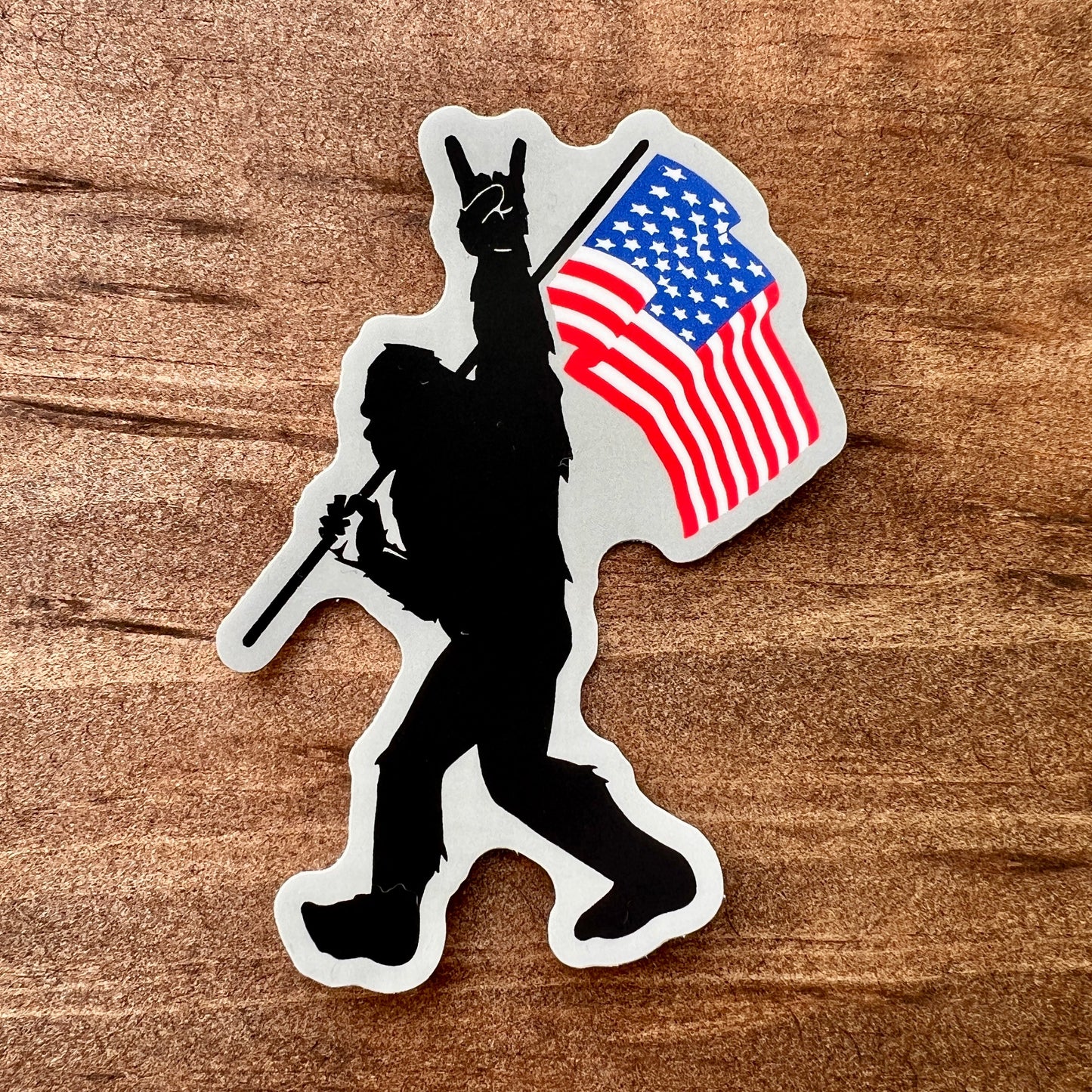 Bigfoot Carrying Flag Sticker by 208 Tees